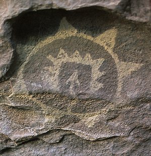photo of sun-like rock art symbol