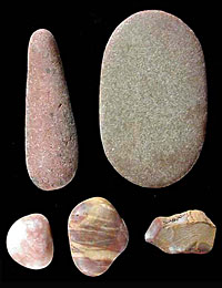 The use of these flat, oval stones is unknown; they may have been handtools for grinding or even gaming pieces.
