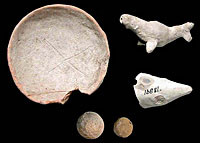 Children's toys, including ceramic whistles (b,c) and marbles (d) were found at the rancho site, along with a child-sized pottery bowl marked on the bottom with an "X." 