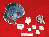 Restorable El Paso Polychrome bowl from Room 25 with several of its rim sherds and a partial gourd-shaped ladle from same room.