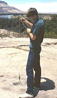 Tom O'Laughlin helps map Robledo Mountain Pueblo near Las Cruces, New Mexico, while still a teenager. His precocious archeological work as a high school student earned him an award from the New Mexico Archaeological Society and set his career path. Photo by Dave John.