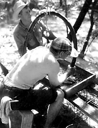 Loyd Harper and Tom Lothrop waterscreening to search for trade beads. Photo by E. Mott Davis.