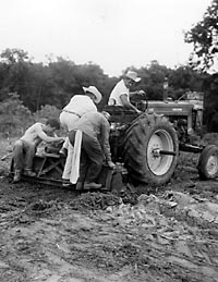 Additional weight was needed to allow a tractor to scrape the surface of several areas of the site in search of postholes. None was found.