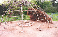 Reconstructed hut at the Nightengale Archeological Center, showing framework and construction. Photo by Gene Schaffner.