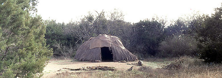 Reconstructed hut at the Nightengale Archeological Center, believed to resemble in size and form the dwellings of prehistoric Texans. Photo by Milton Bell.