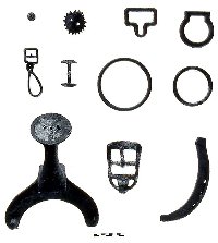 Bits of harness, tack, and saddlery are reminders of the farm animals at the site. At top left is a small brass harness bell; at bottom left, a saddle pommel. 
