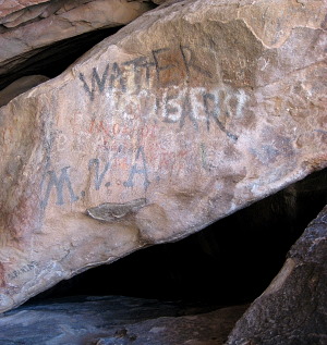 photo of the misspelled inscription in wagon grease, “Watter hear,” 