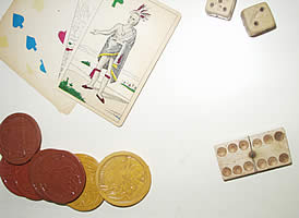 photo of antique poker cards, chips and dice