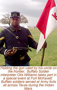 photo of a man in uniform holding a flag and a gun