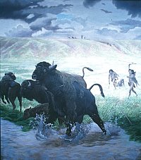 Archaic hunters spring up from the grass to hurl darts with atlatls at bison at the lake's edge. The hunters disguised themselves as wolves and slowly creeped closer before springing. On the horizon family members watch the scene hoping for a successful hunt. 