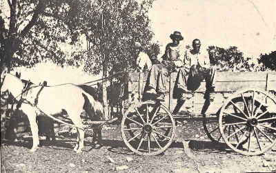old photo shows three men of the Kincheon family on a wagon like the one Ransom would have had