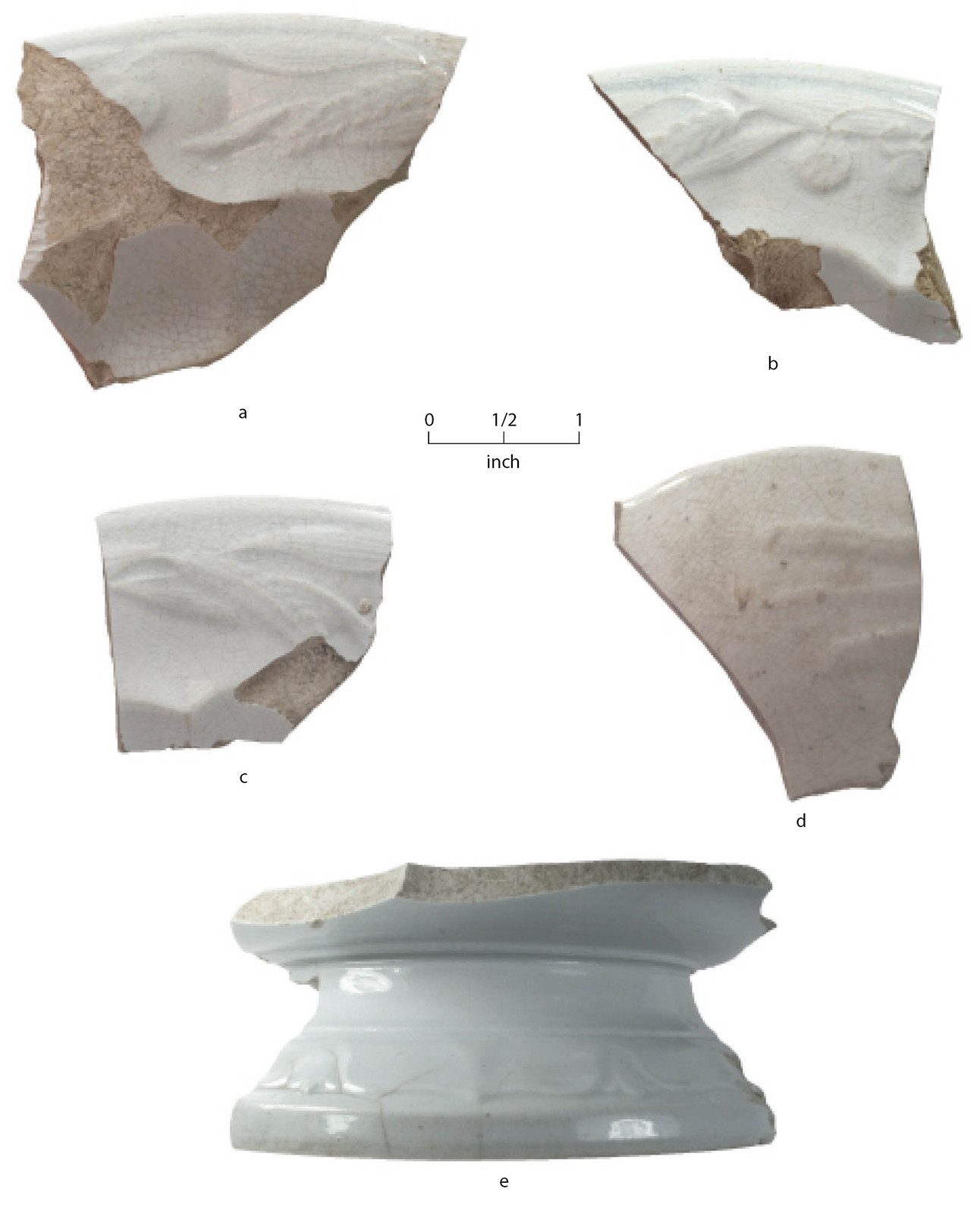 White pottery sherds on a white background with a scale bar.