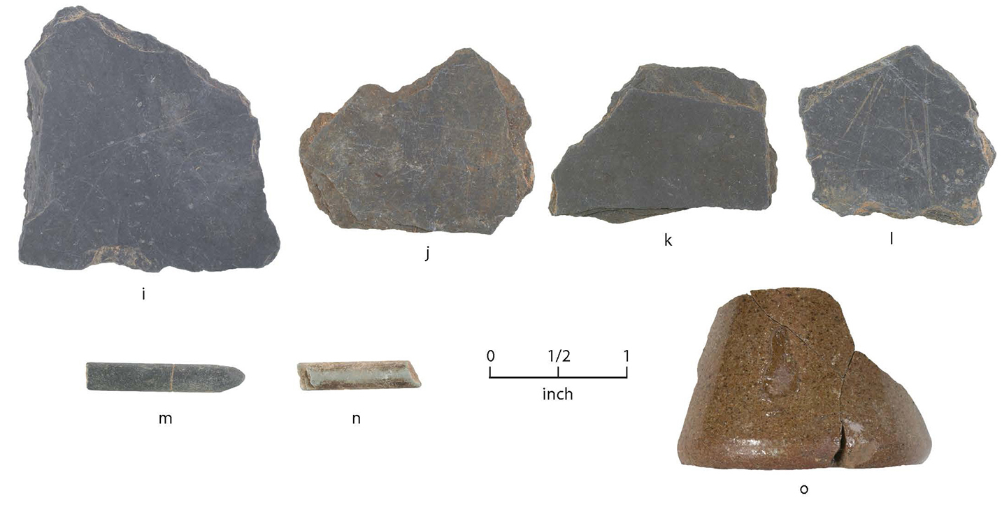 color photo of fragmentary historic artifacts arranged in two rows, four items on top, three at bottom