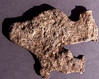 These pieces of melted lead from the mission provide evidence of the fire that burned the buildings down. Records and inventories indicate that there were several soldiers stationed at the mission to provide protection. Juan Leal was one of these soldiers. They had lead with them for making musket balls.