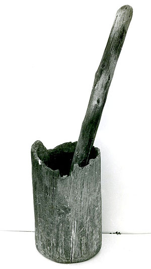 photo of a wooden mortar made from piñon