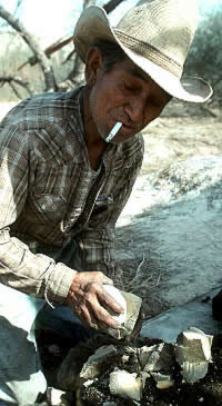 photo of a worker using a hammerstone